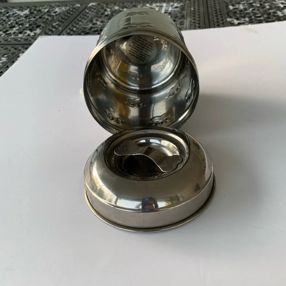 Dog treat canister with paw prints to keep small dog treats